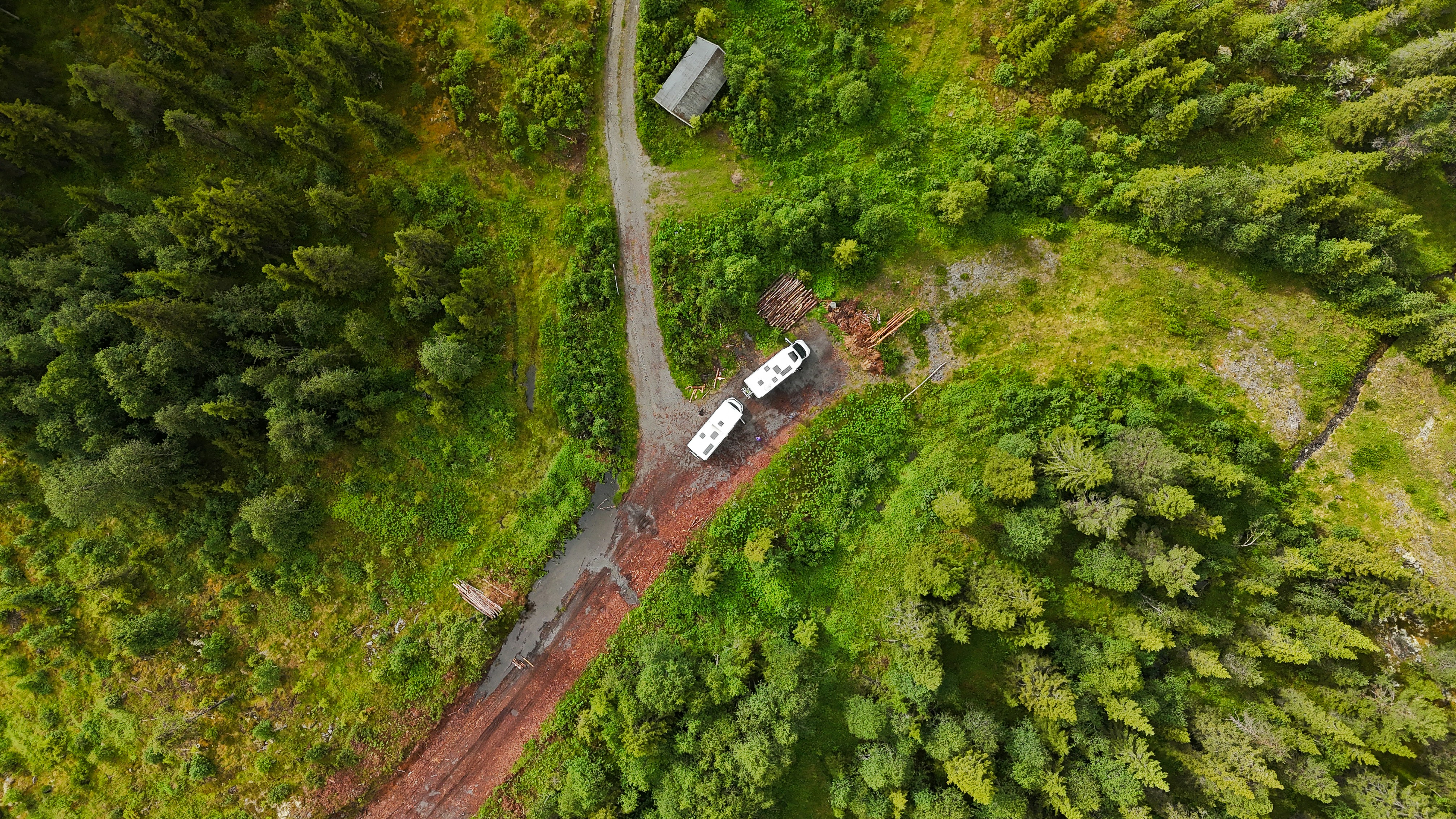 Aerial view of a campervan on a coastal road