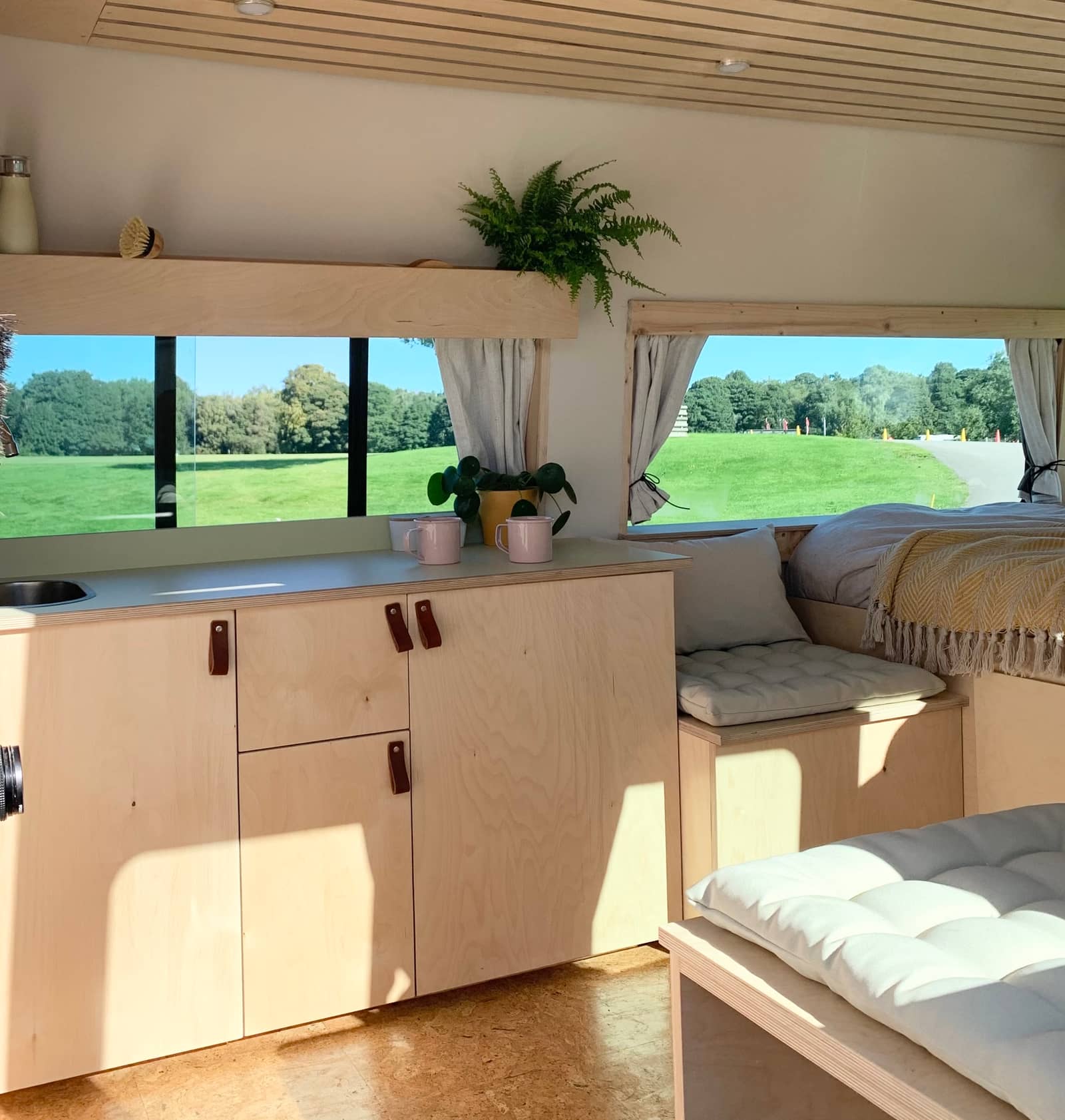 Person cleaning a campervan