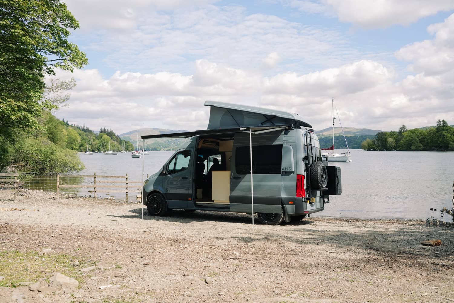 Coastal landscape with campervan from above